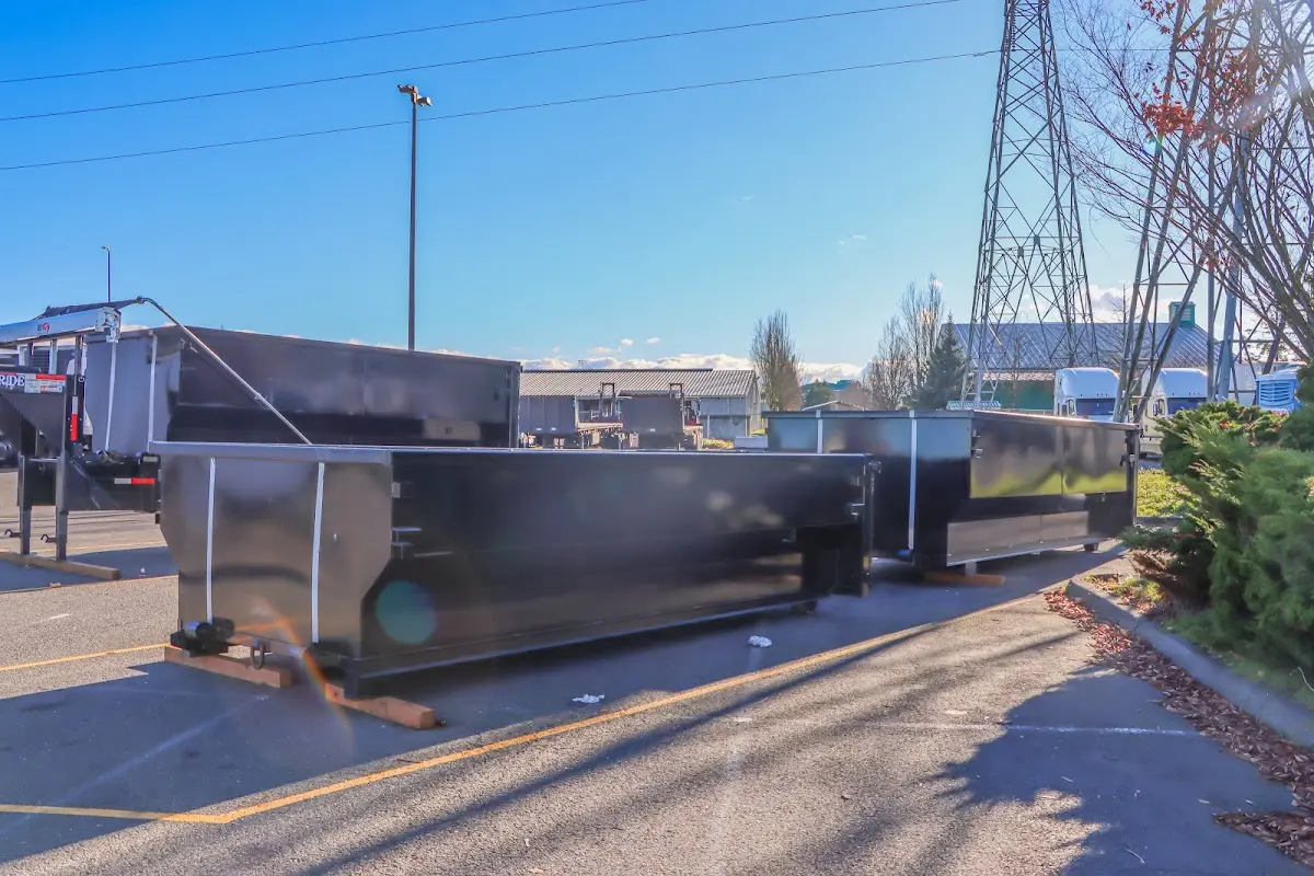 Roll-off dumpster ready for waste disposal at job site for 2 Yard Dumpster Rental in Lawrence